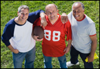 Three men with a football