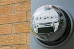 An electromechanical electric meter on the side of a house. | Photo courtesy of ©iStockphoto/epantha
