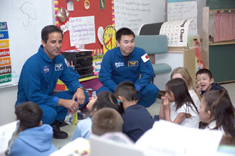NASA astronauts talk with local school children.