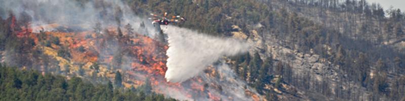 September 6th, 2010. Smoke fills the air as the wildfire is being doused via a fire rescue helicopter.