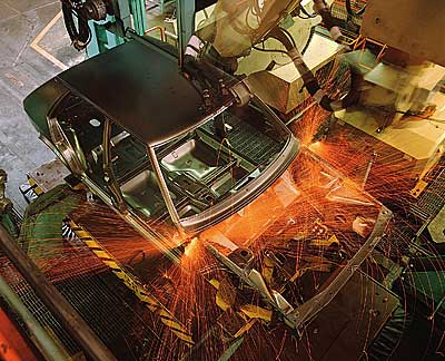 welding auto frame on assembly line