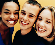 Photograph of two female teens and one male teen