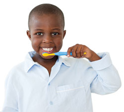 Boy holding toothbrush
