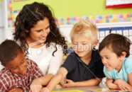 Young Teacher Playing Game With Children
