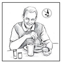 Drawing of a man sitting at a table, eating a bowl of soup. He is holding a roll and a drink sits on the table in front of him. A “no alcohol” symbol is in the upper right corner.