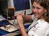 A female LARSS intern works with electronic equipment