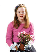 A young girl with down syndrome holding flowers