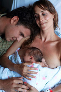 picture of a newborn, a man and woman