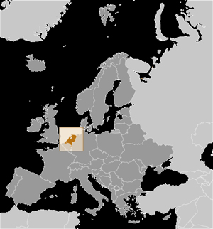 Map of Europe with grey countries and a box that highlights the Netherlands which is colored orange.