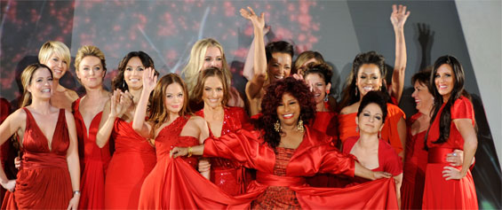 17 of today's hottest celebrities in designer red dresses pose at the end of the runway after 2012's Heart Truth Fashion Show. Chaka Khan stands in front of all the women opening the side panels of her dress as she takes her bow.