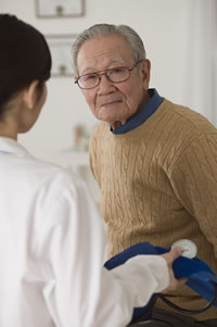Photo: older adult man with doctor