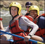 Photo: People in a raft with safety equipment