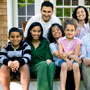 Extended Hispanic family smiling