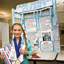 Photo: girl before her "Are Icicles Clean" display board.
