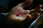 A malnourished boy holds an iron supplement pill in his palm before swallowing it at a supplementary feeding clinic in Kohistan, about 50 km north of Kabul, May 24, 2004. REUTERS/Tim Wimborne