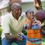 Photo: Man and boy playing ball