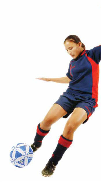 Photo: girl kicking soccer ball