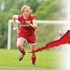 A photo of a Michelle Backus running playing soccer.