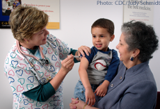 A child receiving an immunization injection in his shoulder