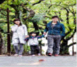 Mother, father, and child walking