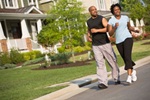 photo of couple walking in neighborthood