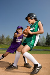 girls playing softball