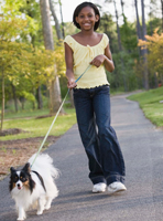 girl walking dog