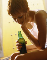 young woman with a beer