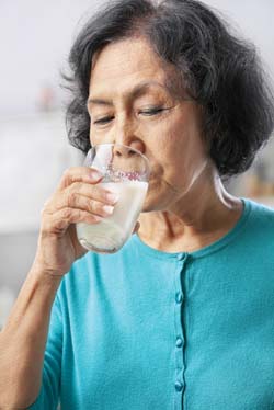 A woman drinking milk