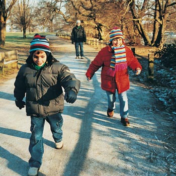 two children running in the park