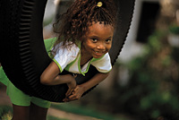 girl swinging on tire swing