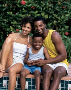 A family sitting by the pool