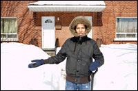 Photo: A person standingby a snow bank.