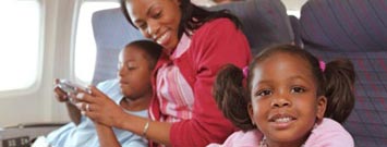 Photo: Mother and children on an airplane.