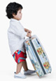 Toddler carrying a suitcase