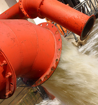 Photo: Water Rushing From Red Pipes