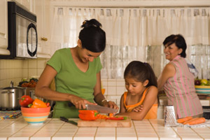 family cooking in kitchen