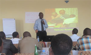 Eugene Zimulinda, DOD-Rwanda, answers questions from Peace Corps Volunteers and their local counterparts following a training in March 2011 on how to recognize and respond to the signs of abuse, neglect, and violence among children in Rwanda.