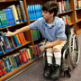 Photo: Boy in wheelchair in library