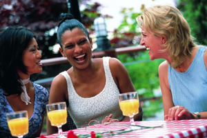 a group of three women laughing