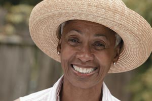 woman in a hat smiling