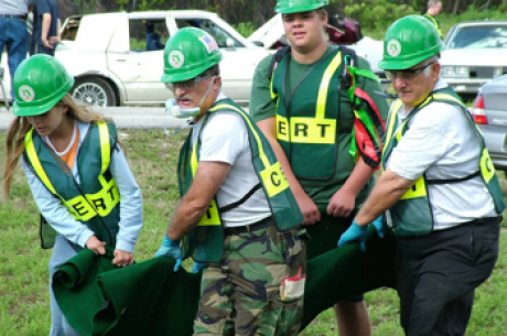 CERT members carrying a disaster survivor