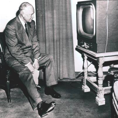 Photo: On September 25, 1952 Republican presidential candidate Dwight D. Eisenhower watches his running mate, Richard Nixon, make his famous televised Checkers Speech.  This scene was in a side room in Cleveland's Public Hall.  (62-357-1)