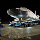 Photo: Space Shuttle Endeavour Move

The space shuttle Endeavour is seen atop the Over Land Transporter (OLT) after exiting the Los Angeles International Airport on its way to its new home at the California Science Center in Los Angeles, Friday, Oct. 12, 2012.  Endeavour, built as a replacement for space shuttle Challenger, completed 25 missions, spent 299 days in orbit, and orbited Earth 4,671 times while traveling 122,883,151 miles. Beginning Oct. 30, the shuttle will be on display in the CSC’s Samuel Oschin Space Shuttle Endeavour Display Pavilion, embarking on its new mission to commemorate past achievements in space and educate and inspire future generations of explorers. Photo Credit: (NASA/Bill Ingalls)