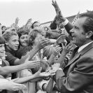 Photo: D0202-10  President Nixon greeting the children in the crowd of students outside a Dwight D. Eisenhower High School building in Utica, Michigan, where he attended a dedication ceremony. 8/24/1972.