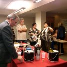 Photo: SBA’s Kimberly Donahue provides business expertise to ‘encore’ entrepreneurs Yanging Shao, University of Charleston student; Leo Lopez, SBA (forward); Ron Chapman, Marsha Chapman, Kim Donahue, SBA, Joetta Kuhn, CPA (background sitting), Gaylene Miller, AARP (background standing)