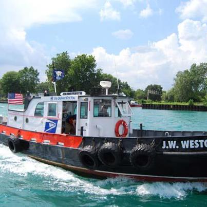 Photo: The JW Westcott, a 45-foot contract mail boat for USPS, delivers mail to passing ships in the Detroit River. This just seemed more feasible than asking our Letter Carriers to swim.