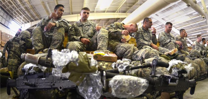 Photo: Paratroopers from 2nd Brigade Combat Team, 82nd Airborne Division relax with some chow Oct. 8, at Pope Army Airfield, N.C., prior to an airborne operation. About 1,300 paratroopers from the brigade combat team jumped into Folk Polk, La., for a month-long Joint Readiness Training Exercise rotation. U.S. Army photo by Army Sgt. 1st Class Michael J. Carden