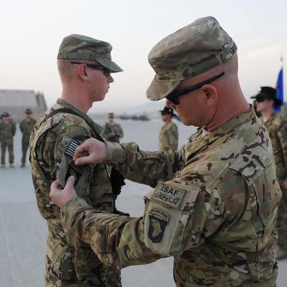 Photo: 1st Sgt. Stephen Givens, Bravo Company, 1st Battalion, 101st Combat Aviation Brigade puts the 101st Airborne Division Combat Patch on his son Pfc. Zachery Givens, Bravo Company, 6th Battalion, 101st CAB, Wings of Destiny during a ceremony at Forward Operating Base Fenty Oct 7, 2012. Pfc. Givens decided to enlist in the Army during his father's last deployment with the 101st CAB. The 101st Airborne Division (Air Assault) lineage runs deep not just in history but within our families. There are many families within our Division that have more than one family member deployed to Operation Enduring Freedom.