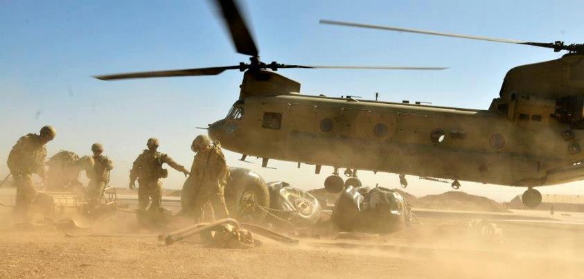 Photo: A CH-47F Chinook helicopter takes off as Soldiers assigned to 3rd Battalion, 158th Aviation Regiment, attached to the 25th Combat Aviation Brigade, hook up equipment used to set up a Forward Arming and Refueling Point as part of an exercise in Afghanistan, Oct. 3. Photo by Sgt. Daniel Schroeder